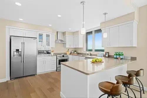 A kitchen with a breakfast bar in a Mirabella at ASU apartment.